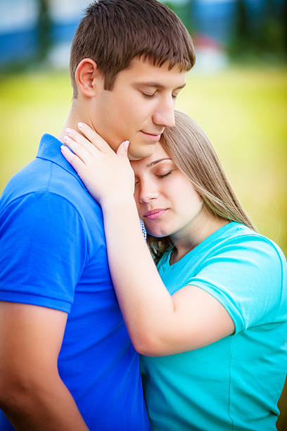 istock Romantic couple relaxing in field 535722919