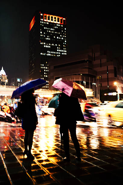 istock Sheltering from the rain, at night. Taiwan 535724205