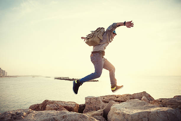 istock traveler running at sunset 535726919