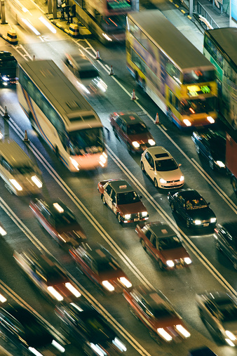 A busy highway during the evening, light streaks and motion blur, Hong Kong.  Travel background. 