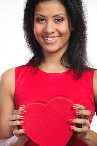 istock lovely woman with red heart shaped gift box 535762467