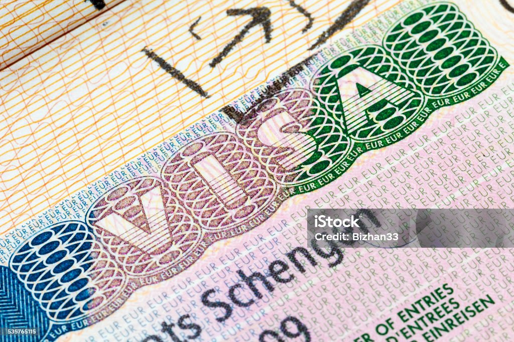 Schengen visa in the passport European Schengen visa stamp in the passport Passport Stamp Stock Photo