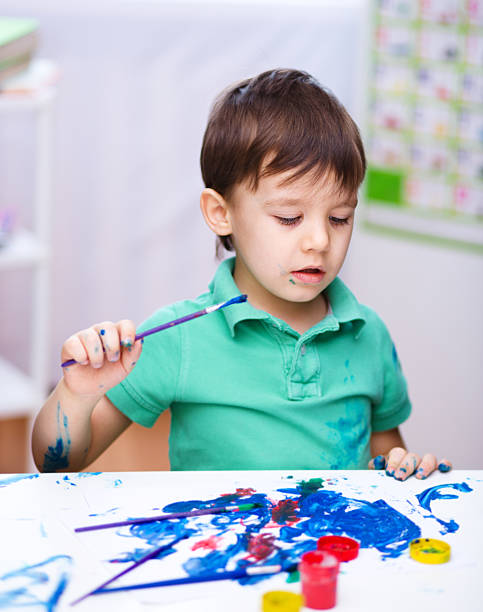 istock Little boy is playing with paints 535766387