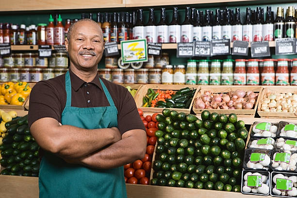 greengrocer - supermarket sales clerk grocer apron ストックフォトと画像