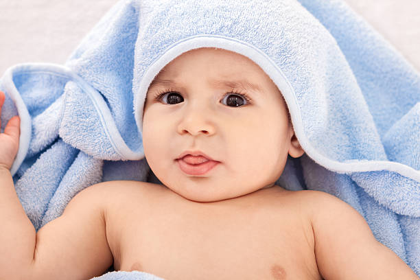 istock Baby after shower with blue towel 535767653