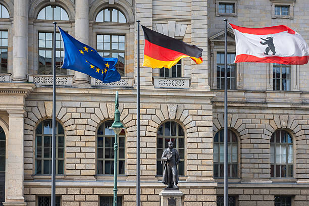 istock 3 flags (Europe, Germany, Berlin) infront of Abgeordnetenhaus 535769721