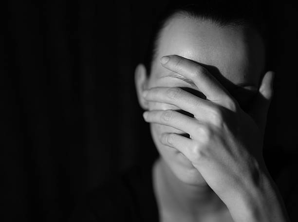 Depression Depressed woman covering her face. defeat photos stock pictures, royalty-free photos & images