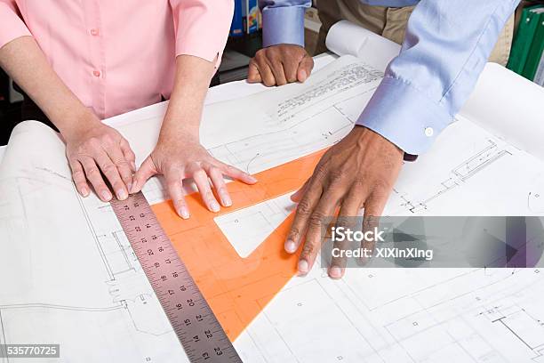 Architects Measuring Blueprint Stock Photo - Download Image Now - Blueprint, 2015, Accuracy