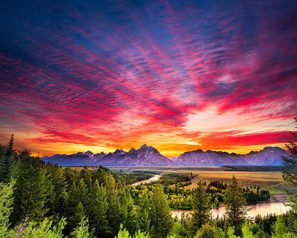 Summer Sunset at Snake River Overlook Colorful sunset at Snake River Overlook in Grand Teton National Park, WY teton range photos stock pictures, royalty-free photos & images