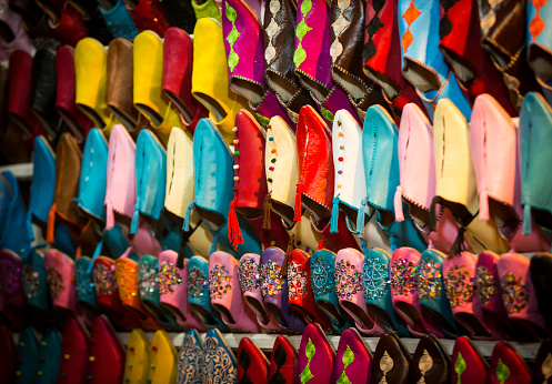 Moroccan slippers / shoes lined up in a street market - Marrakesh souk, Morocco