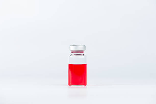 istock Red liquid in medicine vial 535772699