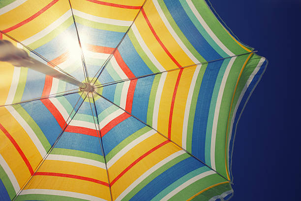 istock Sun is shining through a colorful umbrella 535792138