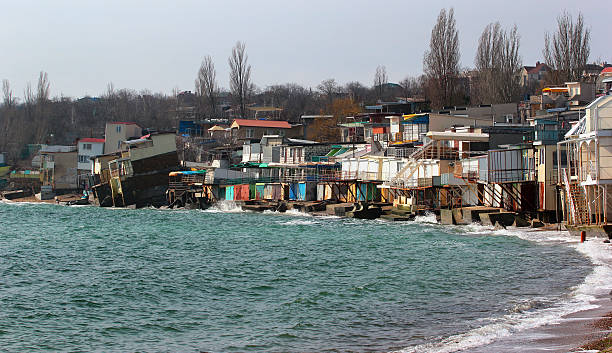 coastal erosion, houses slide down to sea - view into land imagens e fotografias de stock