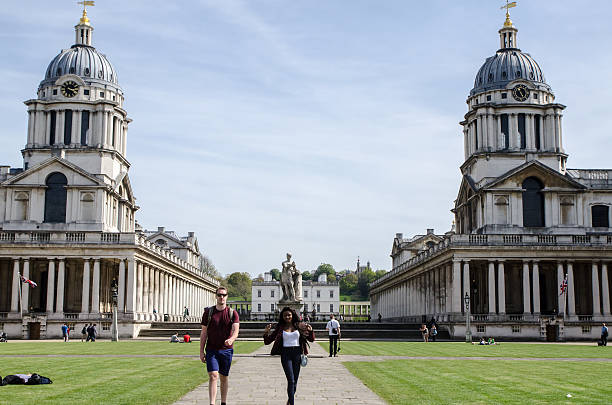 Greenwich University: Queen Mary Court and King William Court London, England - May 5, 2016: Greenwich University: Queen Mary Court, King William Court and Queen's House with people walking down the alley, during day of springtime. queen's house stock pictures, royalty-free photos & images