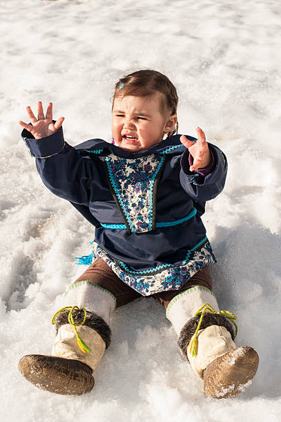 Inuit Child in the Snow, Baffin Island, Nunavut, Canada. Inuit Child in the Snow, Baffin Island, Nunavut, Canada. inuit children stock pictures, royalty-free photos & images