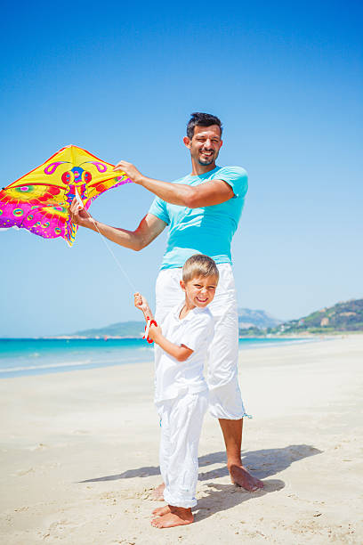 istock Boy and his father with kite 535804795