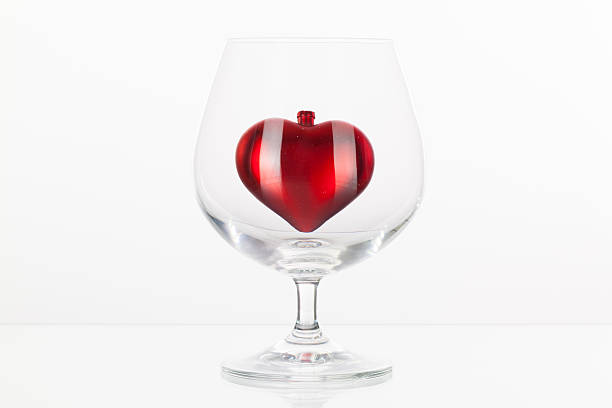 istock Red heart inside a glass of cognac 535805441