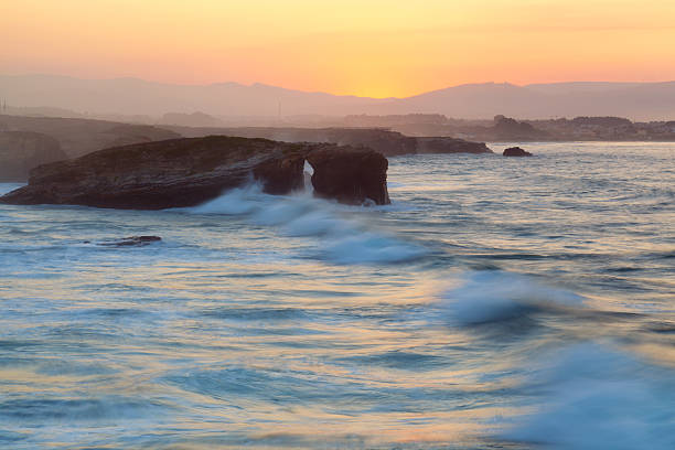 istock Beautiful sunset and stone arches on Playa de las Catedrales 535805705