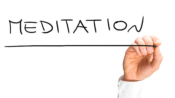 istock Businessman writing Meditation with a black marker 535806711