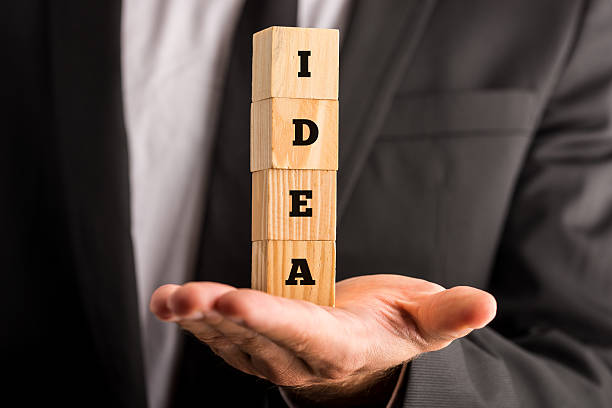 istock Businessman holding cubes with the word Idea 535808165