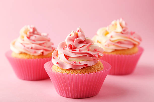istock Tasty cupcake on pink background 535810955
