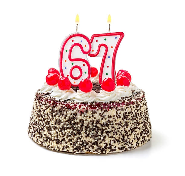 istock Birthday cake with burning candle number 67 535810987