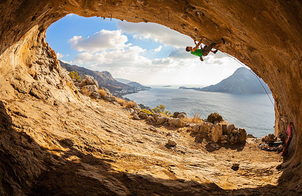 istock Young man lead climbing in cave 535813641
