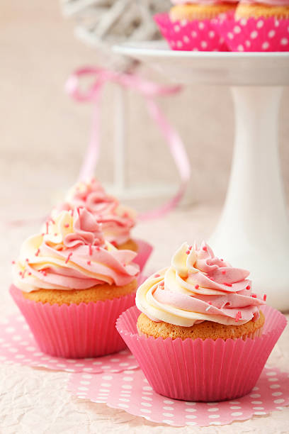 istock Tasty cupcake on pink background 535814575