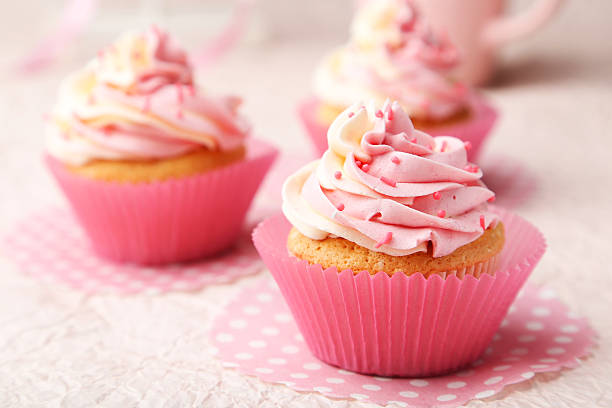 istock Tasty cupcake on pink background 535814579