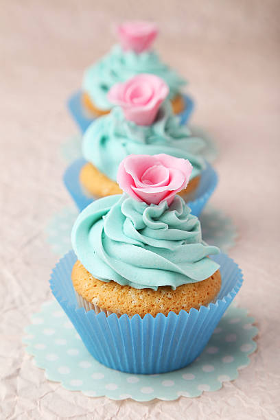 istock Tasty cupcake on pink background 535814585