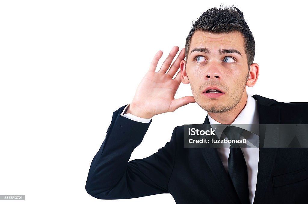 Isolated business man Isolated young business man listening Ear Stock Photo