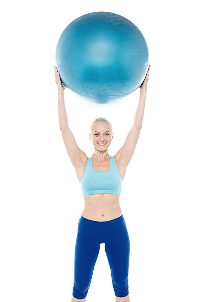 istock Woman exercising with gymnastic ball 535843809