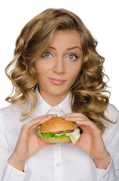 istock Surprised young woman with hamburger 535843855