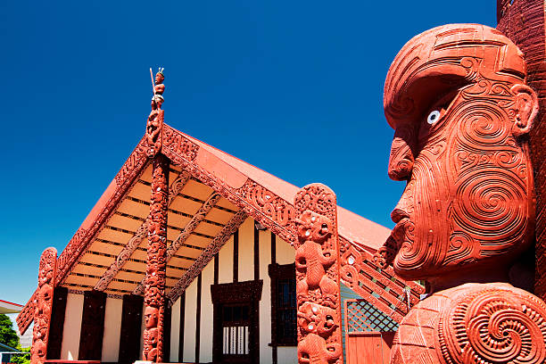 Te Papaiouru Marae, Rotorua, New Zealand - November 11 Rotorua, New Zealand - November 11, 2013: Maori wood carving outside of Te Papaiouru Marae, a Maori meeting house in the tourist town of Rotorua, New Zealand rotorua stock pictures, royalty-free photos & images