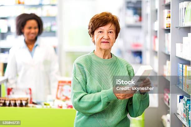 Female Customer In A Pharmacy Stock Photo - Download Image Now - Customer, Medicine, 2015