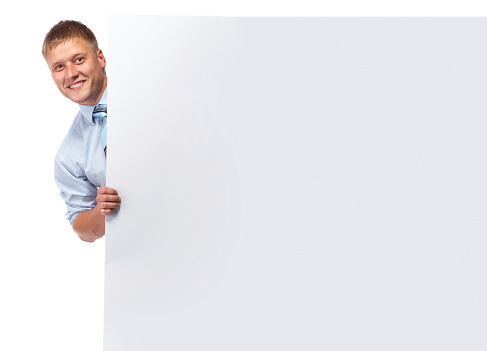 Businesmann handing big business card over white background