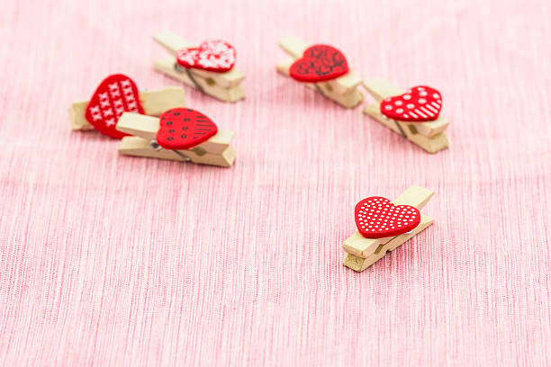 Wooden clothespin heart shaped.