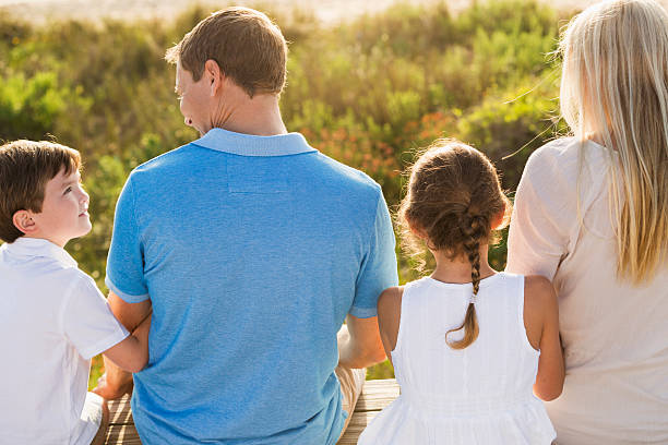 istock Family of four at beach 535847887