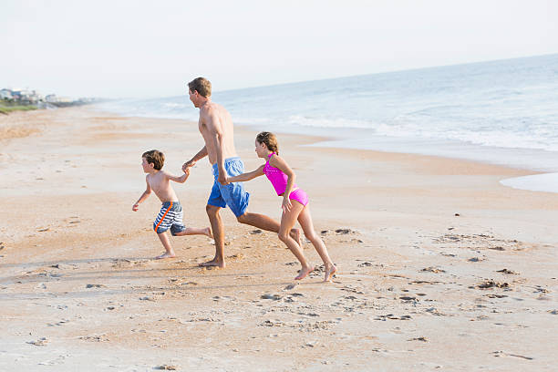 istock Family at the beach 535847909