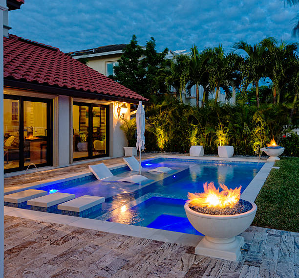 Swimming Pool Beautiful swimming pool with early morning sun in the tropics. building feature stock pictures, royalty-free photos & images