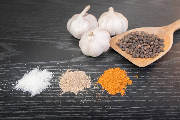 istock assorted spices and condiments on table black wooden 535848331