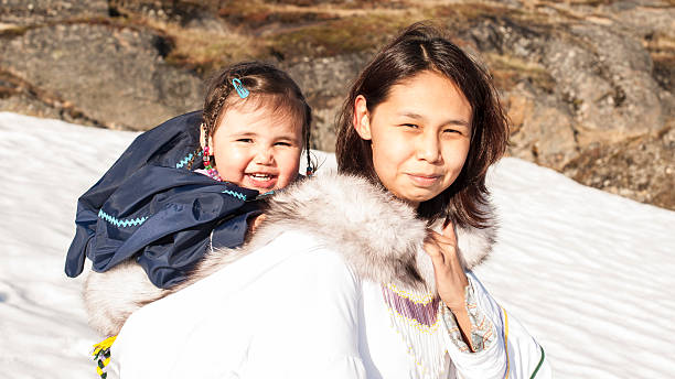 Inuit Mother and Daughter on Baffin Island, Nunavut, Canada. stock photo
