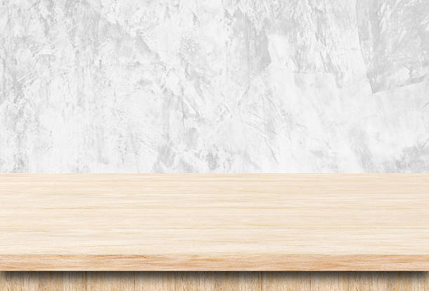 istock Empty wooden table over grunge cement wall. 535848795