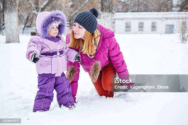 Mother And Daughter In Winter Park Stock Photo - Download Image Now - 2015, Activity, Adult