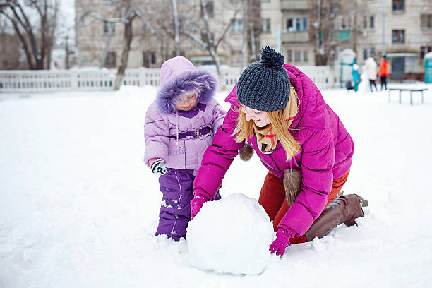istock Mother and daughter in winter park 535850301
