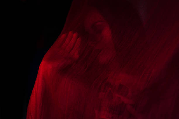 istock Girl posing with red fabric 535850605