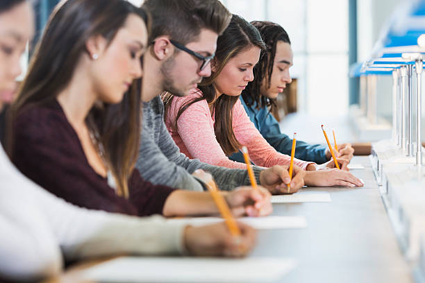 istock Group of teenagers taking a test 535851509