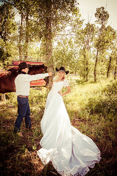 istock Cowboy Pointing A Gun At His Bride 535851821