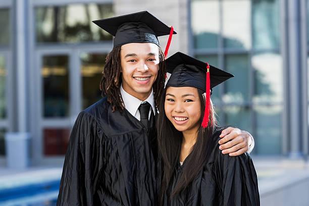 istock Portrait of two friends graduating from school 535852067