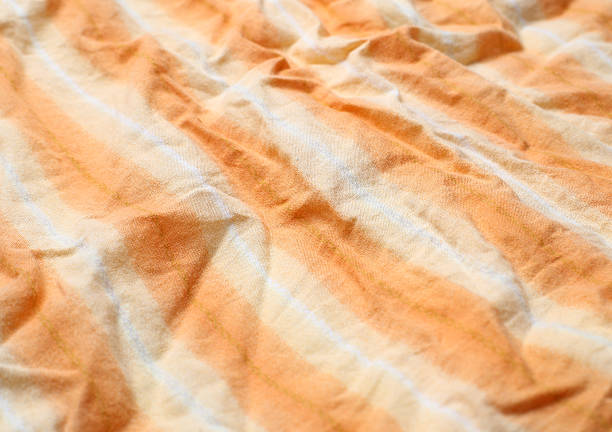istock the wrinkled of clothes pattern orange color for background 535867309